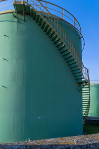 View of storage tank and pipes of chemical industry, italy