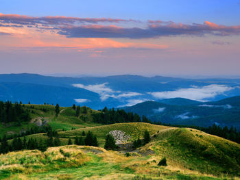 Scenic view of landscape against sky during sunset