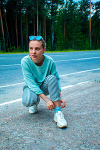 Portrait of boy sitting in park