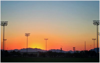 Silhouette landscape against sky during sunset