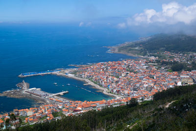 High angle view of townscape by sea