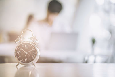 Close-up of clock on table