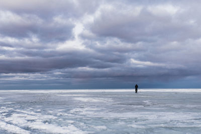 Man on sea against sky