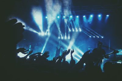 People enjoying music concert