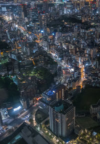 High angle view of illuminated buildings in city at night