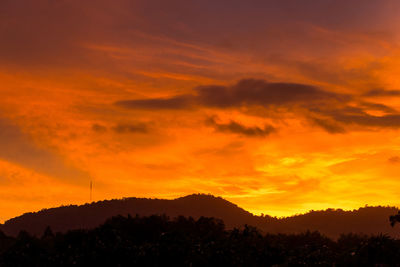 Scenic view of dramatic sky during sunset