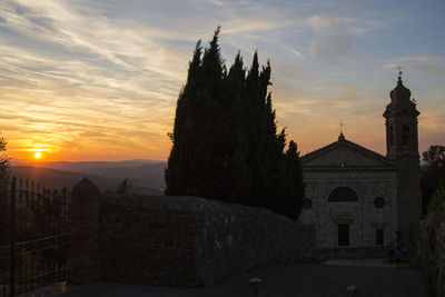 Exterior of historic building against sky during sunset