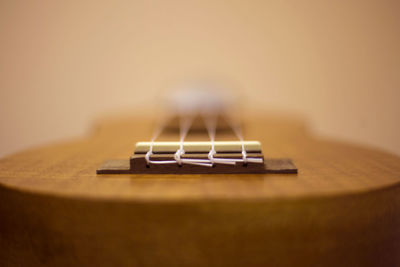 Close-up of guitar on table