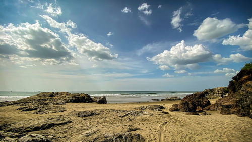 Scenic view of beach against sky