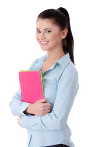 Portrait of a smiling young woman against white background