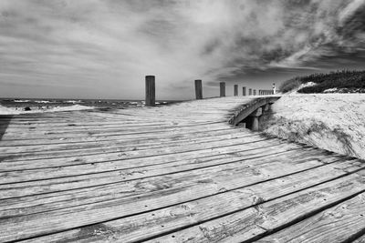 Pier over sea against sky