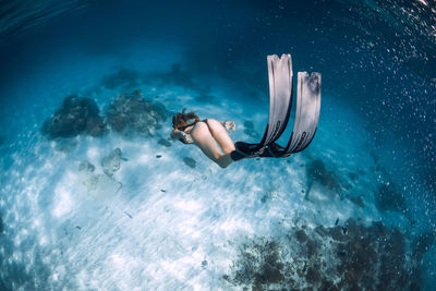 Woman swimming in sea