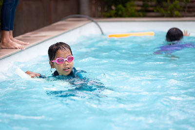 Girl swimming in pool