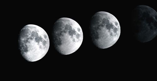 Low angle view of moon against sky at night