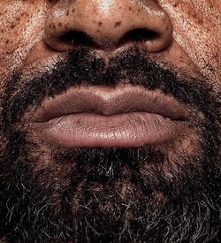 Close-up of man lips with beard