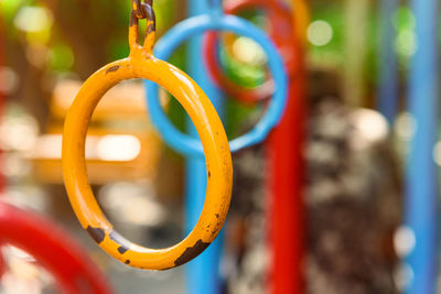 Close up of colorful metallic rings at playground