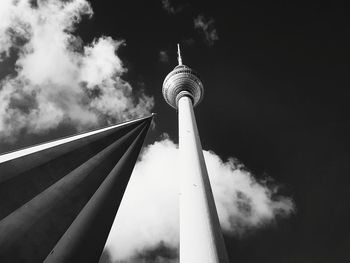 Low angle view of communications tower against sky