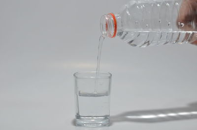 Close-up of glass pouring water