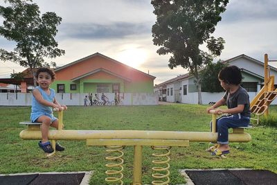Full length of boy on plants