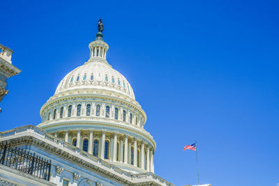 Low angle view of building against blue sky