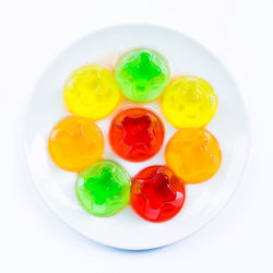 High angle view of multi colored candies in plate