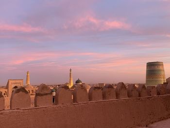 Buildings against sky during sunset