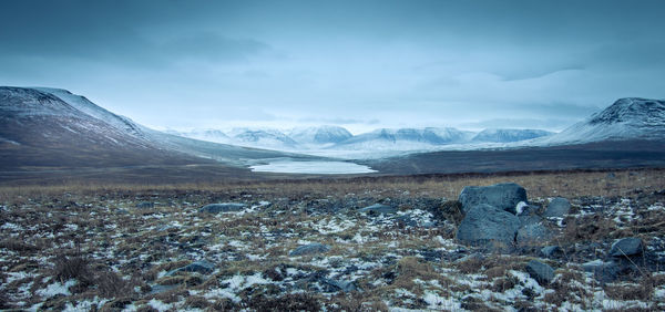 Scenic view of snowcapped mountains against sky