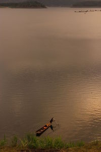 Fishermen at the wadaslintang dam, wonosobo