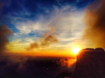 Scenic view of landscape against sky during sunset