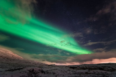 Scenic view of landscape against sky at night