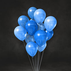 Close-up of balloons against black background