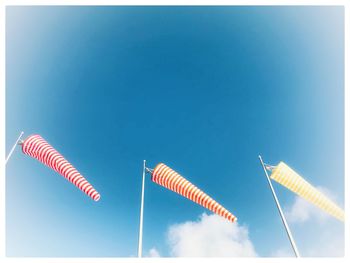 Low angle view of vapor trail against clear blue sky