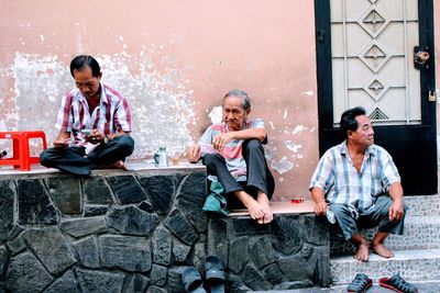 Friends sitting outdoors