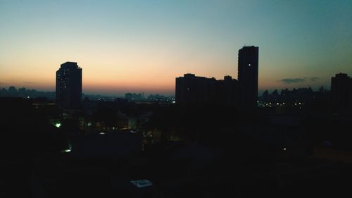 Silhouette of city at night