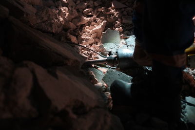 Rear view of man working on rock