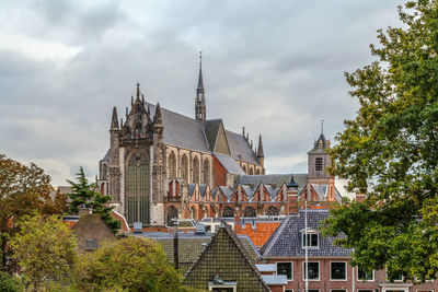 View of buildings against cloudy sky