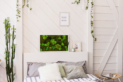 White flowers on bed against wall
