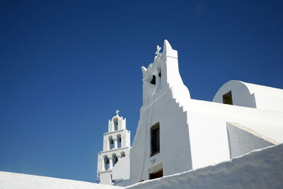 Low angle view of building against clear blue sky