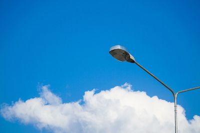 Low angle view of street light against sky