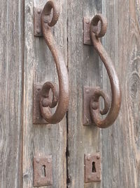 Close-up of rusty metal on wood