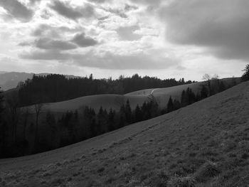 Scenic view of landscape against sky during winter