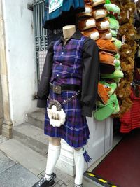 Rear view of woman standing on street