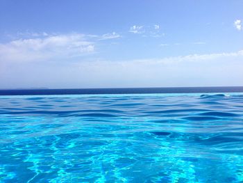 Scenic view of sea against blue sky