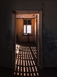 Interior of abandoned house with shadows
