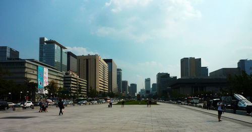 Buildings in city against sky