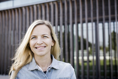 Close-up of smiling woman with blond hair