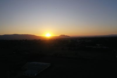 Scenic view of silhouette landscape against sky during sunset