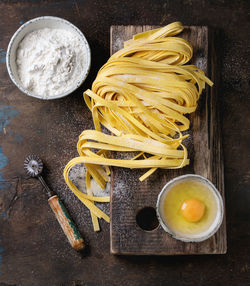 Directly above shot of pasta with ingredients on table