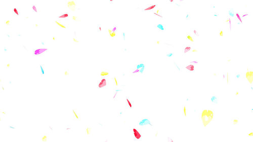 High angle view of multi colored pencils over white background