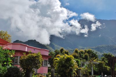 Low angle view of building against cloudy sky